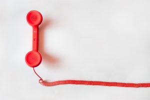 Image of a red phone with red phone cord to call Chuck about your Business Liquidation Sale 